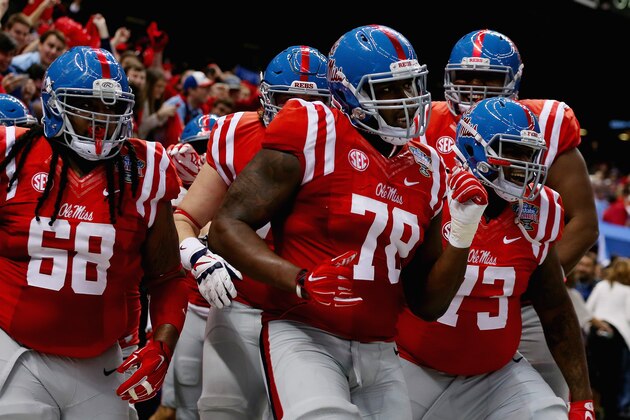 NEW ORLEANS, LA - JANUARY 01:  Laremy Tunsil #78 of the Mississippi Rebels celebrate his touchdown with teammates during the second quarter against the Oklahoma State Cowboys in  the Allstate Sugar Bowl at Mercedes-Benz Superdome on January 1, 2016 in New Orleans, Louisiana.  (Photo by Chris Graythen/Getty Images)