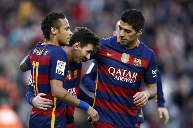 FC Barcelona's Lionel Messi, center, is congratulated by his teammate Luis Suares, right, and Neymar, right, against Granada during a Spanish La Liga soccer match between Barcelona and Granada, at the Camp Nou stadium in Barcelona, Spain, Saturday, Jan. 9, 2016. (AP Photo/Manu Fernandez)