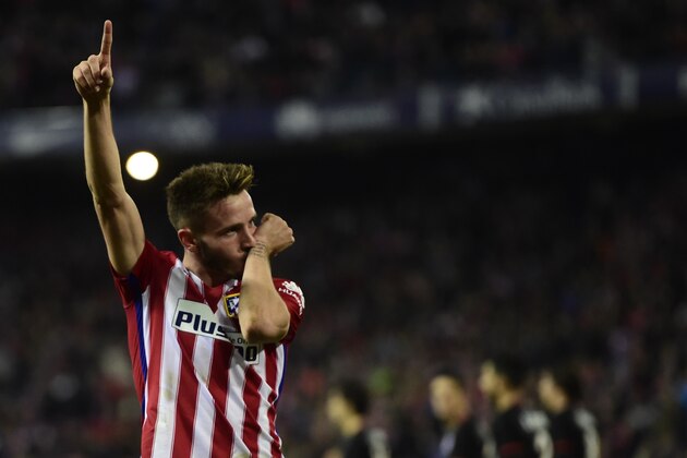 Atletico Madrid's midfielder Saul Niguez celebrates after scoring a goal during the Spanish league football match Club Atletico de Madrid vs Athletic Club Bilbao at the Vicente Calderon stadium in Madrid on December 13, 2015.   AFP PHOTO / JAVIER SORIANO / AFP / JAVIER SORIANO        (Photo credit should read JAVIER SORIANO/AFP/Getty Images)