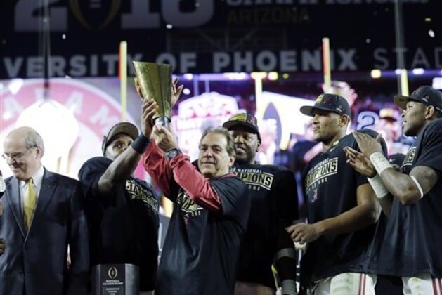 Alabama head coach Nick Saban and players celebrate after the NCAA college football playoff championship game against Clemson Monday, Jan. 11, 2016, in Glendale, Ariz. Alabama won 45-40.  (AP Photo/David J. Phillip)