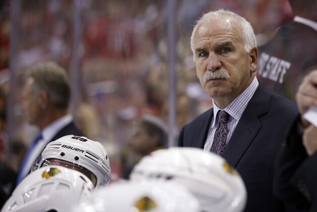 Chicago Blackhawks head coach Joel Quenneville stands in the bench in the third period of an NHL hockey game against the Washington Capitals, Thursday, Oct. 15, 2015, in Washington. The Capitals won 4-1. (AP Photo/Alex Brandon)