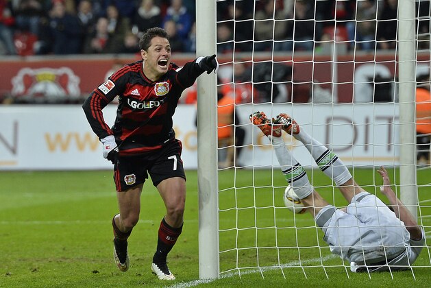 Leverkusen’s Javier Hernandez celebrates his third goal during the German Bundesliga soccer match between Bayer Leverkusen and Borussia Moenchengladbach in Leverkusen, Germany, Saturday, Dec. 12, 2015. Leverkusen defeated Moenchengladbach with 5-0, Hernandez scored three goals. (AP Photo/Martin Meissner)
