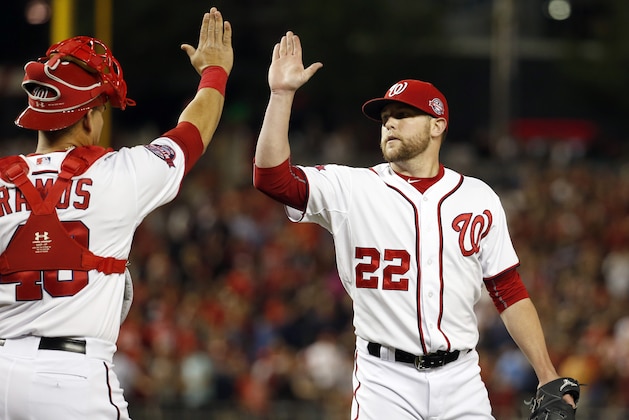Washington Nationals catcher Wilson Ramos (40) celebrates with relief pitcher Drew Storen (22) after a baseball game against the Philadelphia Phillies at Nationals Park, Friday, May 22, 2015, in Washington. The Nationals won 2-1. (AP Photo/Alex Brandon)