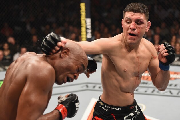 LAS VEGAS, NV - JANUARY 31:  (R-L) Nick Diaz punches Anderson Silva of Brazil in their middleweight bout during the UFC 183 event at the MGM Grand Garden Arena on January 31, 2015 in Las Vegas, Nevada.  (Photo by Josh Hedges/Zuffa LLC/Zuffa LLC via Getty Images)