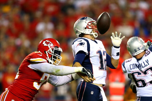 KANSAS CITY, MO - SEPTEMBER 29:  Tamba Hali #91 of the Kansas City Chiefs knocks the ball loose from Tom Brady #12 of the New England Patriots for a fumble during the third quarter at Arrowhead Stadium on September 29, 2014 in Kansas City, Missouri.  (Photo by Dilip Vishwanat/Getty Images)
