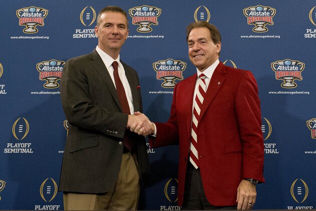 Ohio State coach Urban Meyer, left, and Alabama head coach Nick Saban shake hands during a press conference at the Marriott downtown convention center in New Orleans, Wednesday, Dec. 31, 2014. Ohio State is slated to square off against Alabama in the Sugar Bowl on New Year's Day. (AP Photo/Brynn Anderson)