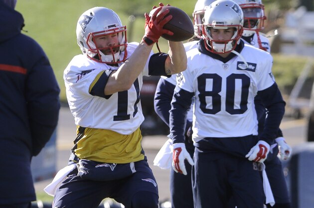 New England Patriots wide receiver Julian Edelman, left, catches the ball as wide receiver Danny Amendola (80) looks on during an NFL football practice, Monday, Jan. 11, 2016, in Foxborough, Mass. The Patriots are to host the Kansas City Chiefs in an NFL divisional playoff game Jan. 16, 2016, in Foxborough. (AP Photo/Steven Senne)