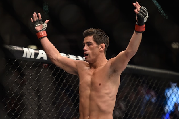 LAS VEGAS, NV - SEPTEMBER 27:  Dominick Cruz celebrates after his TKO victory over Takeya Mizugaki in their bantamweight fight during the UFC 178 event inside the MGM Grand Garden Arena on September 27, 2014 in Las Vegas, Nevada.  (Photo by Jeff Bottari/Zuffa LLC/Zuffa LLC via Getty Images)