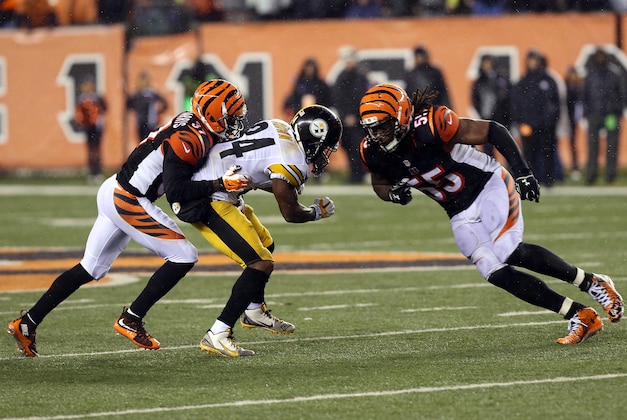 Jan 9, 2016; Cincinnati, OH, USA; Cincinnati Bengals outside linebacker Vontaze Burfict (55) hits Pittsburgh Steelers wide receiver Antonio Brown (84) during the fourth quarter in the AFC Wild Card playoff football game at Paul Brown Stadium. Burfict was called for a personal foul on the play. Mandatory Credit: Aaron Doster-USA TODAY Sports
