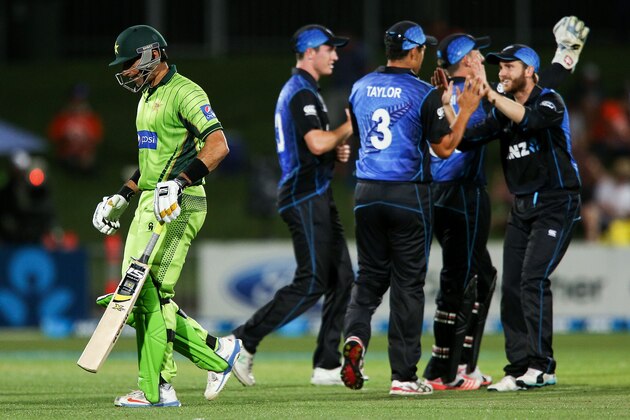NAPIER, NEW ZEALAND - FEBRUARY 03:  Misbah-ul-Haq of Pakistan leaves the field after being dismissed while New Zealand players celebrate during the One Day International match between New Zealand and Pakistan at McLean Park on February 3, 2015 in Napier, New Zealand.  (Photo by Hagen Hopkins/Getty Images)