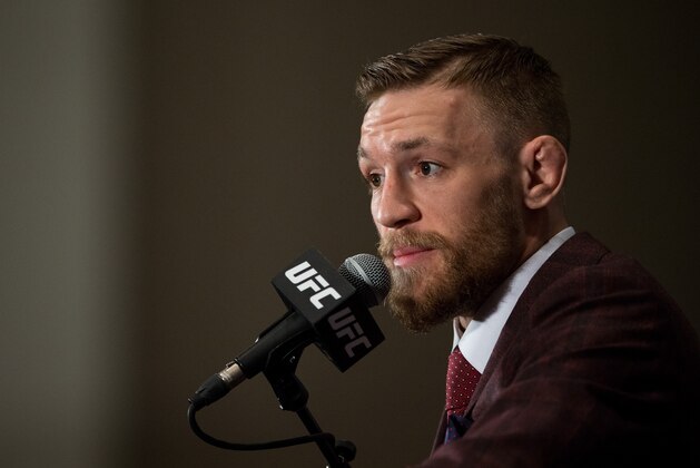 LAS VEGAS, NV - DECEMBER 12:  UFC featherweight champion Conor McGregor speaks to the media at the post fight press conference after his 13 second knockout victory over Jose Aldo in their featherweight championship fight during the UFC 194 event inside MGM Grand Garden Arena on December 12, 2015 in Las Vegas, Nevada.  (Photo by Brandon Magnus/Zuffa LLC/Zuffa LLC via Getty Images)