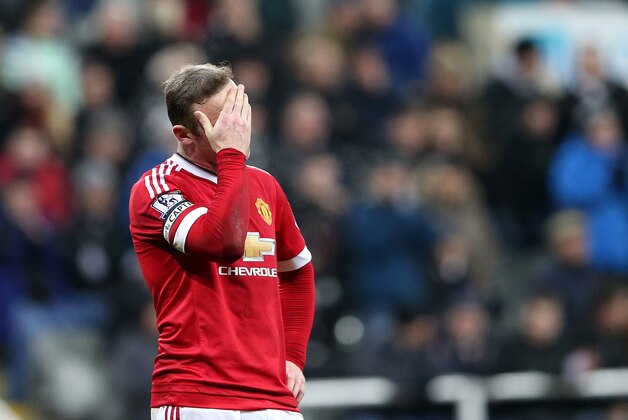 Manchester United's captain Wayne Rooney stands dejected after missing a chance to score during the English Premier League soccer match between Newcastle United and Manchester United at St James' Park, Newcastle, England, Tuesday, Jan. 12, 2015. (AP Photo/Scott Heppell)