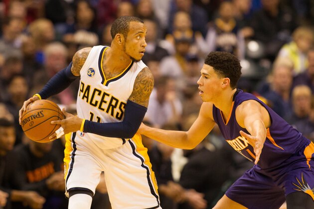Jan 12, 2016; Indianapolis, IN, USA; Indiana Pacers guard Monta Ellis (11) looks to pass the ball as Phoenix Suns guard Devin Booker (1) defends in the first quarter at Bankers Life Fieldhouse. Mandatory Credit: Trevor Ruszkowski-USA TODAY Sports