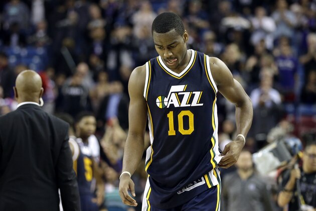 Utah Jazz guard Alec Burks walks off the court after the Jazz lost to the Sacramento Kings 114-106 in an NBA basketball game in Sacramento, Calif., Tuesday, Dec. 8, 2015.(AP Photo/Rich Pedroncelli)