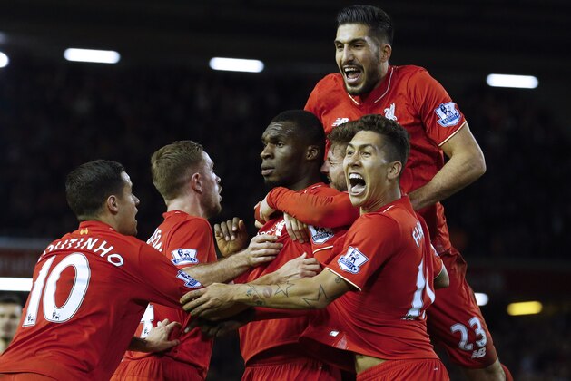 Liverpool's Zaire-born Belgian striker Christian Benteke (C) celebrates with teammates after scoring the opening goal of during the English Premier League football match between Liverpool and Leicester City at the Anfield stadium in Liverpool, north-west England on December 26, 2015. AFP PHOTO / LINDSEY PARNABY
RESTRICTED TO EDITORIAL USE. No use with unauthorized audio, video, data, fixture lists, club/league logos or 'live' services. Online in-match use limited to 75 images, no video emulation. No use in betting, games or single club/league/player publications. / AFP / LINDSEY PARNABY (Photo credit should read LINDSEY PARNABY/AFP/Getty Images) Liverpool's Zaire-born Belgian striker Christian Benteke (C) celebrates with teammates after scoring the opening goal of during the English Premier League football match between Liverpool and Leicester City at the Anfield stadium in Liverpool, north-west England on December 26, 2015. AFP PHOTO / LINDSEY PARNABY
RESTRICTED TO EDITORIAL USE. No use with unauthorized audio, video, data, fixture lists, club/league logos or 'live' services. Online in-match use limited to 75 images, no video emulation. No use in betting, games or single club/league/player publications. / AFP / LINDSEY PARNABY (Photo credit should read LINDSEY PARNABY/AFP/Getty Images)