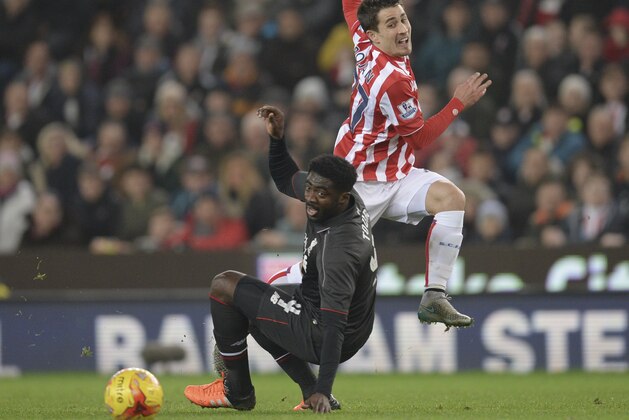 Liverpool's Ivorian defender Kolo Toure (L) tackles Stoke City's Spanish striker Bojan Krkic (R) during the English League Cup semi-final first leg football match at Britannia Stadium in Stoke-on-Trent, central England, on January 5, 2016. AFP PHOTO / OLI SCARFF
RESTRICTED TO EDITORIAL USE. No use with unauthorized audio, video, data, fixture lists, club/league logos or 'live' services. Online in-match use limited to 75 images, no video emulation. No use in betting, games or single club/league/player publications. / AFP / OLI SCARFF (Photo credit should read OLI SCARFF/AFP/Getty Images) Liverpool's Ivorian defender Kolo Toure (L) tackles Stoke City's Spanish striker Bojan Krkic (R) during the English League Cup semi-final first leg football match at Britannia Stadium in Stoke-on-Trent, central England, on January 5, 2016. AFP PHOTO / OLI SCARFF
RESTRICTED TO EDITORIAL USE. No use with unauthorized audio, video, data, fixture lists, club/league logos or 'live' services. Online in-match use limited to 75 images, no video emulation. No use in betting, games or single club/league/player publications. / AFP / OLI SCARFF (Photo credit should read OLI SCARFF/AFP/Getty Images)