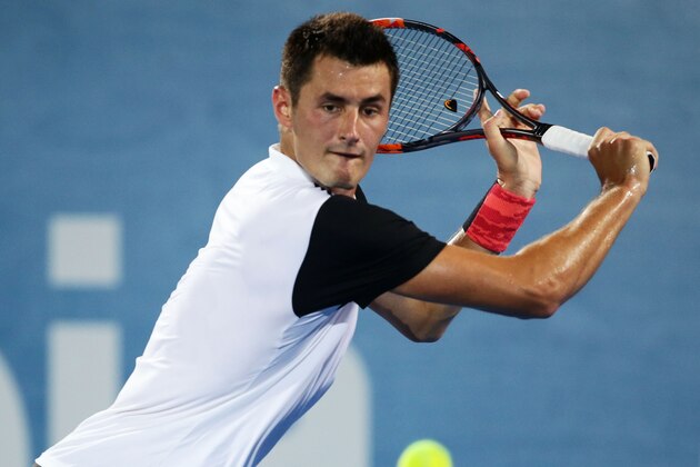 SYDNEY, AUSTRALIA - JANUARY 13:  Bernard Tomic of Australia plays a backhand in his match against Jordan Thompson of Australia during day four of the Sydney International at Sydney Olympic Park Tennis Centre on January 13, 2016 in Sydney, Australia.  (Photo by Matt King/Getty Images)