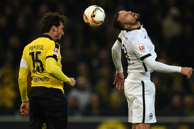 Dortmund's defender Mats Hummels (L) and Frankfurt's Swiss forward Haris Seferovic vie for the ball during the German first division Bundesliga football match Borussia Dortmund vs Eintracht Frankfurt in Dortmund, western Germany, on December 13, 2015. AFP PHOTO / PATRIK STOLLARZ

RESTRICTIONS: DURING MATCH TIME: DFL RULES TO LIMIT THE ONLINE USAGE TO 15 PICTURES PER MATCH AND FORBID IMAGE SEQUENCES TO SIMULATE VIDEO. == RESTRICTED TO EDITORIAL USE == FOR FURTHER QUERIES PLEASE CONTACT DFL DIRECTLY AT + 49 69 650050. / AFP / PATRIK STOLLARZ        (Photo credit should read PATRIK STOLLARZ/AFP/Getty Images)