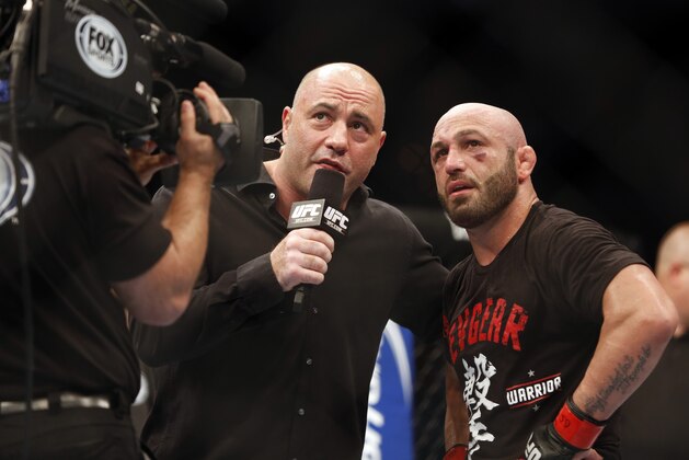 Manny Gamburyan is interviewed by Joe Rogan after defeating Cole Miller in their UFC on Fox Sports 1 mixed martial arts bout in Boston, Saturday, August 17,2013. Gamburyan won via decison. (AP Photo/Gregory Payan)