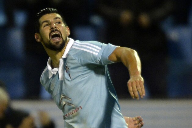 Celta Vigo's forward Nolito celebrates after scoring a goal during the Spanish league football match RC Celta de Vigo vs Real Sporting de Gijon at the Balaidos stadium in Vigo on November 28, 2015.   Celta won the match 2-1. AFP PHOTO/ MIGUEL RIOPA / AFP / MIGUEL RIOPA        (Photo credit should read MIGUEL RIOPA/AFP/Getty Images)