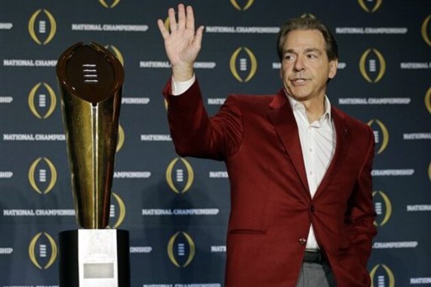 Alabama head coach Nick Saban poses with the championship trophy during a news conference for the NCAA college football playoff championship Tuesday, Jan. 12, 2016, in Scottsdale, Ariz. Alabama beat Clemson 45-40 to win the championship. (AP Photo/David J. Phillip)