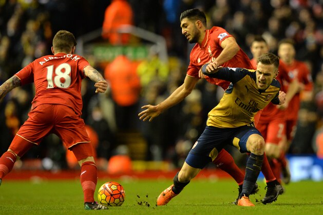Arsenal's Welsh midfielder Aaron Ramsey (R) vies with Liverpool's German midfielder Emre Can during the English Premier League football match between Liverpool and Arsenal at Anfield stadium in Liverpool, north-west England on January 13, 2016.
AFP PHOTO / PAUL ELLIS
RESTRICTED TO EDITORIAL USE. NO USE WITH UNAUTHORIZED AUDIO, VIDEO, DATA, FIXTURE LISTS, CLUB/LEAGUE LOGOS OR 'LIVE' SERVICES. ONLINE IN-MATCH USE LIMITED TO 75 IMAGES, NO VIDEO EMULATION. NO USE IN BETTING, GAMES OR SINGLE CLUB/LEAGUE/PLAYER PUBLICATIONS. / AFP / PAUL ELLIS        (Photo credit should read PAUL ELLIS/AFP/Getty Images)