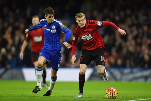 LONDON, ENGLAND - JANUARY 13: James McClean of West Bromwich Albion and Oscar of Chelsea compete for the ball during the Barclays Premier League match between Chelsea and West Bromwich Albion at Stamford Bridge on January 13, 2016 in London, England.  (Photo by Shaun Botterill/Getty Images)