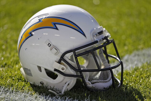 A San Diego Chargers helmet sits on Lambeau Field prior to the start of an NFL football game between the Green Bay Packers and San Diego Chargers Sunday Oct. 18, 2015, in Green Bay, Wis. (AP Photo/Matt Ludtke)