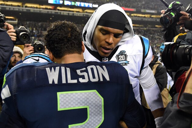 SEATTLE, WA - JANUARY 10:  Russell Wilson #3 of the Seattle Seahawks shakes hands with Cam Newton #1 of the Carolina Panthers after their 2015 NFC Divisional Playoff game at CenturyLink Field on January 10, 2015 in Seattle, Washington. The Seattle Seahawks defeated the Carolina Panthers 31 to 17.(Photo by Steve Dykes/Getty Images)