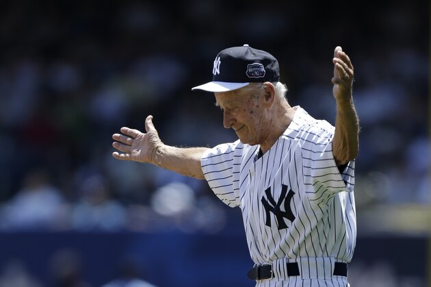 FILE- In this June 23, 2013, file photo, former New York Yankees relief pitcher and scout Luis Arroyo acknowledges the crowd as he is introduced to fans before the Yankees 67th annual Old Timers Day baseball game at Yankee Stadium in New York. The Yankees said Arroyo's daughter, Milagros, told the team Wednesday, Jan. 13, 2016, that Arroyo had died earlier in the day in Puerto Rico. He was 88. (AP Photo/Kathy Willens, File)