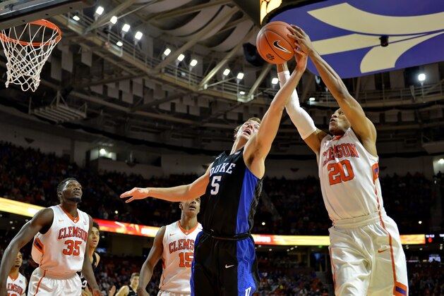Clemson's Jordan Roper (20) pulls a rebound away from Duke's Luke Kennard during the second half of an NCAA college basketball game Wednesday, Jan. 13, 2016, in Greenville, S.C. Clemson won 68-63. (AP Photo/Richard Shiro)