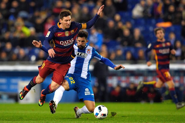 Barcelona's Argentinian forward Lionel Messi (L) vies with Espanyol's defender Alvaro Gonzalez (R) during the Spanish Copa del Rey (King's Cup) round of 16 second leg football match RCD Espanyol vs FC Barcelona at Cornella-El Prat stadium in Cornella near Barcelona, on January 13, 2016. AFP PHOTO/ LLUIS GENE / AFP / LLUIS GENE        (Photo credit should read LLUIS GENE/AFP/Getty Images)