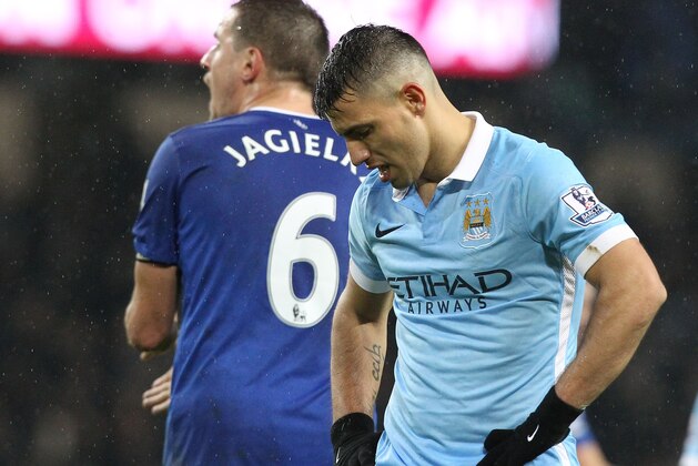 Manchester City's Argentinian striker Sergio Aguero reacts after missing a shot on goal during the English Premier League football match between Manchester City and Everton at the Etihad stadium in Manchester, north west England on January 13, 2016.
AFP PHOTO / LINDSEY PARNABY
RESTRICTED TO EDITORIAL USE. NO USE WITH UNAUTHORIZED AUDIO, VIDEO, DATA, FIXTURE LISTS, CLUB/LEAGUE LOGOS OR 'LIVE' SERVICES. ONLINE IN-MATCH USE LIMITED TO 75 IMAGES, NO VIDEO EMULATION. NO USE IN BETTING, GAMES OR SINGLE CLUB/LEAGUE/PLAYER PUBLICATIONS. / AFP / LINDSEY PARNABY        (Photo credit should read LINDSEY PARNABY/AFP/Getty Images)