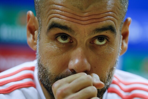 Bayern's head coach Pep Guardiola listens during a press conference at Emirates stadium in London Monday, Oct. 19, 2015. Arsenal will play Bayern Munich in a Champions League Group F soccer match at the stadium on Tuesday. (AP Photo/Kirsty Wigglesworth)