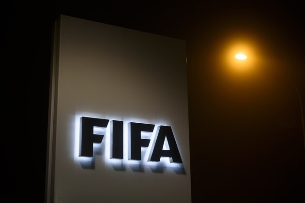 A sign of the FIFA is seen at the entrance of its headquarters on December 3, 2015 in Zurich. 
The multi-million dollar corruption scandal engulfing FIFA widened on December 3, with 16 people indicted by US justice officials who pledged an unremitting crackdown on an 'outrageous' betrayal of trust. / AFP / FABRICE COFFRINI        (Photo credit should read FABRICE COFFRINI/AFP/Getty Images)