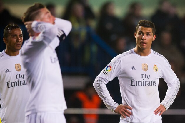 VILLARREAL, SPAIN - DECEMBER 13: Danilo Luiz da Silva (L) and Cristiano Ronaldo of Real Madrid CF look dejected during the La Liga match between Villarreal CF and Real Madrid CF at El Madrigal on December 13, 2015 in Villarreal, Spain. (Photo by Alex Caparros/Getty Images)