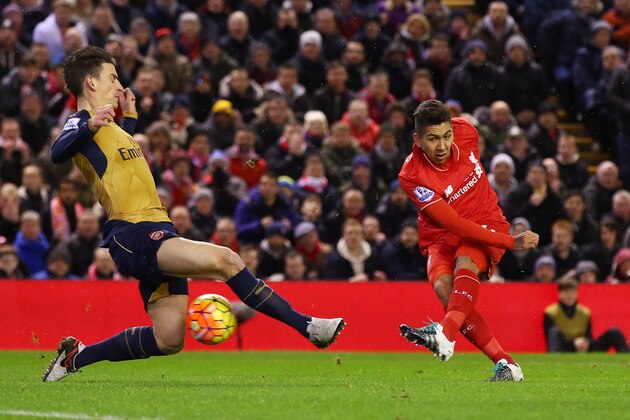 LIVERPOOL, ENGLAND - JANUARY 13: Roberto Firmino of Liverpool scores his team's first goal during the Barclays Premier League match between Liverpool and Arsenal at Anfield on January 13, 2016 in Liverpool, England.  (Photo by Alex Livesey/Getty Images)