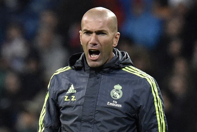 Real Madrid's French coach Zinedine Zidane shouts from the sideline during the Spanish league football match Real Madrid CF vs RC Deportivo La Coruna at the Santiago Bernabeu stadium in Madrid on January 9, 2016.  AFP PHOTO / GERARD JULIEN / AFP / GERARD JULIEN        (Photo credit should read GERARD JULIEN/AFP/Getty Images)