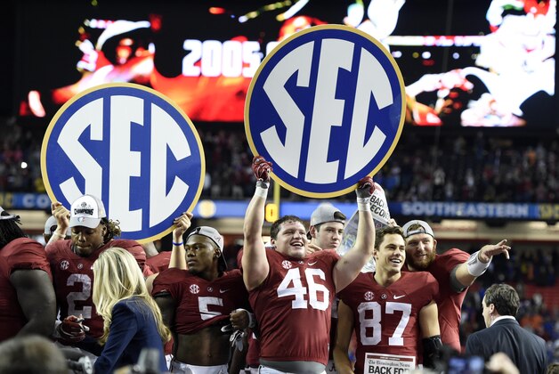 Dec 5, 2015; Atlanta, GA, USA; Alabama Crimson Tide tight end Michael Nysewander (46) celebrates with teammates after defeating the Florida Gators in the 2015 SEC Championship Game at the Georgia Dome. Alabama won 29-15. Mandatory Credit: John David Mercer-USA TODAY Sports