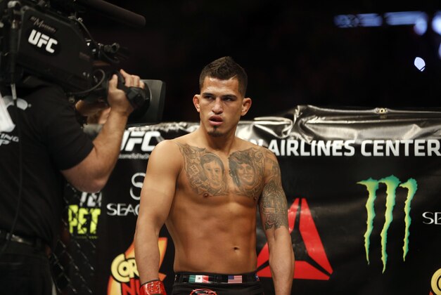 Mar 14, 2015; Dallas, TX, USA; Anthony Pettis (red) before fighting Rafael dos Anjos (blue) in the lightweight title bout during UFC 185 at American Airlines Center. Mandatory Credit: Tim Heitman-USA TODAY Sports