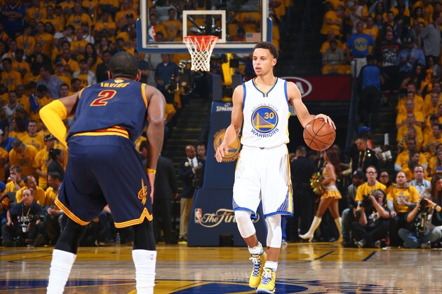 OAKLAND, CA - JUNE 4: Stephen Curry #30 of the Golden State Warriors is guarded by Kyrie Irving #2 of the Cleveland Cavaliers during Game One of the 2015 NBA Finals on June 4, 2015 at Oracle Arena in Oakland, California. NOTE TO USER: User expressly acknowledges and agrees that, by downloading and or using this photograph, user is consenting to the terms and conditions of Getty Images License Agreement. Mandatory Copyright Notice: Copyright 2015 NBAE (Photo by Nathaniel S. Butler/NBAE via Getty Images)