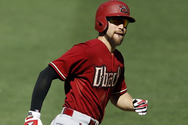 Arizona Diamondbacks Ender Inciarte looks at his bench, rounding third, after hitting a solo home run during the fifth inning of a baseball game against the San Diego Padres in San Diego, Sunday, Sept. 27, 2015. (AP Photo/Alex Gallardo)