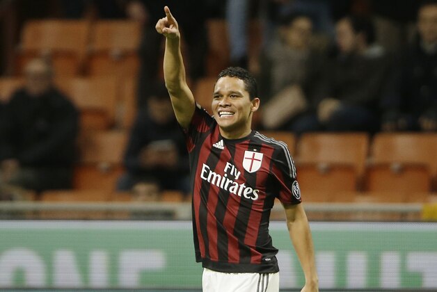AC Milan's Carlos Bacca celebrates after scoring during the Italian Cup soccer match between AC Milan and Carpi at the San Siro stadium in Milan, Italy, Wednesday, Jan. 13, 2016. (AP Photo/Antonio Calanni)