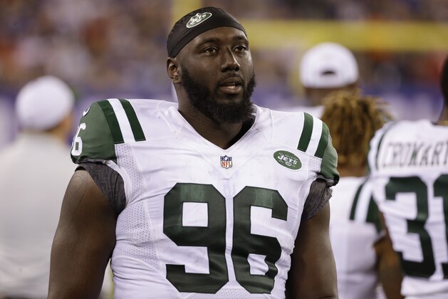 FILE - In this Saturday, Aug. 29, 2015 file photo, New York Jets defensive end Muhammad Wilkerson (96) walks the sidelines during the second half of a preseason NFL football game against the New York Giants in East Rutherford, N.J. Muhammad Wilkerson was 10 when his mother had breast cancer. Wilkerson honored 96 _ the number of his jersey _ breast cancer survivors at a three-course luncheon Tuesday, Oct. 13, 2015 at Central Park restaurant not far from where he grew up. October is the NFL's Breast Cancer Awareness month. (AP Photo/Seth Wenig)