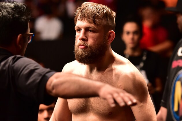 May 30, 2015; Goiania, GO, Brazil;  Nik Lentz (red gloves) reacts before his fight against Charles Oliveira during UFC Fight Night at Goiania Arena. Mandatory Credit: Jason Silva-USA TODAY Sports