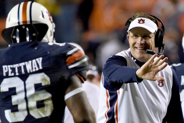 Auburn coach Gus Malzahn celebrates a touchdown with fullback Kamryn Pettway during the second half of an NCAA football game against Idaho, Saturday, Nov. 21, 2015, in Auburn, Ala. (AP Photo/Mark Almond)