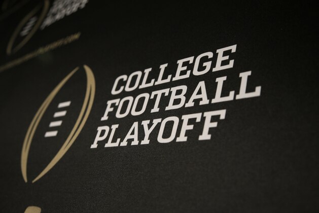 The College Football Playoff logo is printed across a backdrop used during a news conference where the 13 members of the committee were announced, Wednesday, Oct. 16, 2013, in Irving, Texas. Former Secretary of State Condoleezza Rice, former Nebraska coach Tom Osborne and College Football Hall of Fame quarterback Archie Manning are among the 13 people who will be part of the College Football Playoff selection committee in 2014. (AP Photo/Tony Gutierrez)