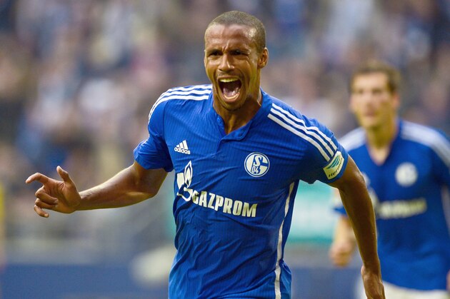 Schalke's Cameroonian defender Joel Matip celebrates after scoring the 1-0 goal during the German first division Bundesliga football match FC Schalke 04 v 1 FSV Mainz 05, in Gelsenkirchen, on September 13, 2015.  AFP PHOTO / SASCHA SCHUERMANN  RESTRICTIONS: DURING MATCH TIME: DFL RULES TO LIMIT THE ONLINE USAGE TO 15 PICTURES PER MATCH AND FORBID IMAGE SEQUENCES TO SIMULATE VIDEO.  == RESTRICTED TO EDITORIAL USE == FOR FURTHER QUERIES PLEASE CONTACT DFL DIRECTLY AT + 49 69 650050.        (Photo credit should read SASCHA SCHUERMANN/AFP/Getty Images)