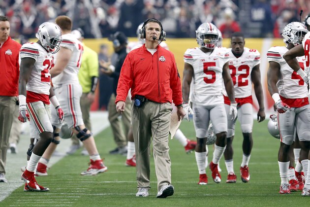Ohio State head coach Urban Meyer walks the sidelines during the first half of the Fiesta Bowl NCAA College football game against Notre Dame , Friday, Jan. 1, 2016, in Glendale, Ariz.  (AP Photo/Rick Scuteri)