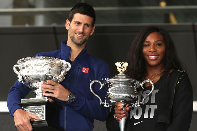 Defending champions Serena Williams of the US and Serbia's Novak Djokovic pose for a photo with their trophies as they arrive for the official draw at the Australian Open tennis championships in Melbourne, Australia, Friday, Jan. 15, 2016. (AP Photo/Mark Baker)